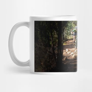 Mountain Biker getting air on a dark single track Mug